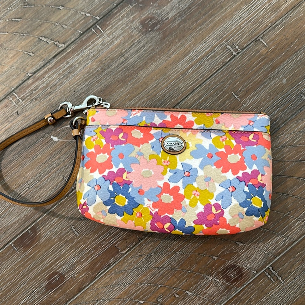 Pristine spring/ summery coach wristlet 6x4 inches and 1 inch wide.